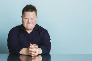 confident boy with downs sydrome