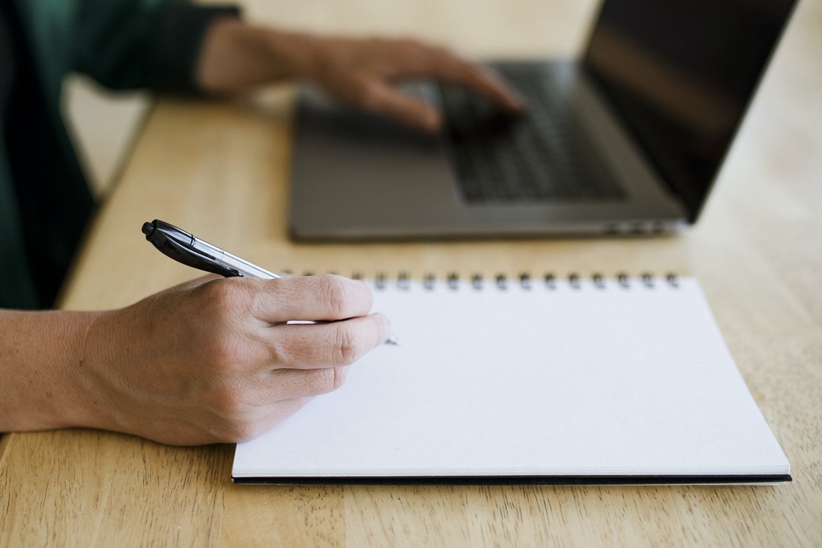 Woman writing a CV