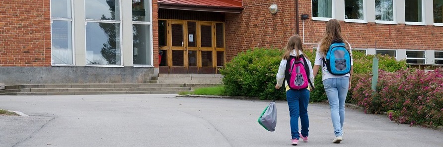 two-children-outside-school